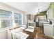 Bright dining area with natural light, adjacent to an updated kitchen with stainless steel appliances at 12516 Cobble Stone Dr, Hudson, FL 34667