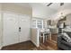 Cozy living space with front door view, open layout, and a dining area nearby at 12516 Cobble Stone Dr, Hudson, FL 34667