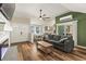 Spacious living area with a modern fireplace, dining area and slider leading to backyard at 12516 Cobble Stone Dr, Hudson, FL 34667