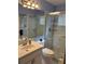 Bathroom with a sink vanity, a toilet, and glass enclosed shower at 13339 Amberwood St, Hudson, FL 34669