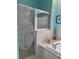 Elegant bathroom featuring a glass shower with a custom palm tree design at 13339 Amberwood St, Hudson, FL 34669