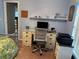 Well-lit bedroom area featuring a desk, shelves, and comfortable office space at 13339 Amberwood St, Hudson, FL 34669