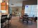 Cozy dining area with a round table, seamlessly connected to the kitchen and living room at 13339 Amberwood St, Hudson, FL 34669