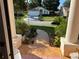 View from porch with tiled floor overlooking the front lawn and street at 13339 Amberwood St, Hudson, FL 34669