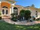 Landscaped front yard featuring colorful plants and rock garden at 13339 Amberwood St, Hudson, FL 34669