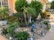 Well maintained front yard with shrubs, gravel and exterior lighting at 13339 Amberwood St, Hudson, FL 34669