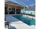 Enjoy this screened-in pool, perfect for relaxing and entertaining guests at 13339 Amberwood St, Hudson, FL 34669