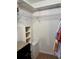 Spacious walk-in closet with shelving and ample storage space for organization at 13339 Amberwood St, Hudson, FL 34669