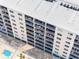 Aerial view of multiple condo balconies with furniture for residents to enjoy at 13500 Gulf Blvd # 506, Madeira Beach, FL 33708