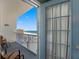 Balcony view showcasing the ocean and beach with chairs and table at 13500 Gulf Blvd # 506, Madeira Beach, FL 33708