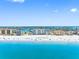 Stunning aerial view of the beach featuring beautiful ocean views and nearby waterfront condominiums at 13500 Gulf Blvd # 506, Madeira Beach, FL 33708