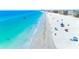 Picturesque aerial shot of a beautiful sandy beach with clear water, perfect for swimming and sunbathing at 13500 Gulf Blvd # 506, Madeira Beach, FL 33708