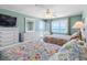 Lovely bedroom with two beds, dresser, and balcony overlooking the ocean at 13500 Gulf Blvd # 506, Madeira Beach, FL 33708