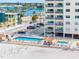 Beach condo complex with a pool, hot tub, parking, and beach access at 13500 Gulf Blvd # 506, Madeira Beach, FL 33708