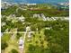 Aerial view of the neighborhood with lush greenery and views of the water at 14318 Guava St, Hudson, FL 34667