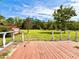 Spacious backyard and a wooden deck with a red outbuilding at 14318 Guava St, Hudson, FL 34667