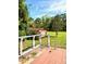 Spacious backyard and a wooden deck with a red outbuilding at 14318 Guava St, Hudson, FL 34667