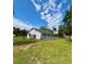 Quaint single-story home featuring a ramp; enveloped by lush greenery and a tranquil country ambiance at 14318 Guava St, Hudson, FL 34667