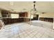 Partially renovated kitchen with tile flooring, exposed studs, and space for customization and modern upgrades at 14318 Guava St, Hudson, FL 34667
