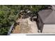 Aerial view of a spacious backyard with a patio, privacy fence, and ample room for recreation and relaxation at 15561 Stone House Dr, Brooksville, FL 34604