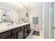 Bathroom with double sink vanity and walk-in shower at 15561 Stone House Dr, Brooksville, FL 34604