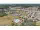 Aerial view showcasing the community pool, playground, and surrounding neighborhood at 15561 Stone House Dr, Brooksville, FL 34604