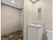 Bathroom featuring a white vanity with a marble countertop and wooden floors at 16070 La Bella St, Brooksville, FL 34604