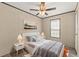 Comfortable bedroom with cozy decor and natural light streaming in through the window at 16070 La Bella St, Brooksville, FL 34604