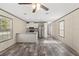 Open kitchen and living area with stainless appliances and lots of natural light at 16070 La Bella St, Brooksville, FL 34604