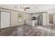 Well-lit room featuring an open kitchen with modern appliances and ample cabinet space at 16070 La Bella St, Brooksville, FL 34604