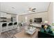 Bright living room open to kitchen, dining area, and stylish modern decor at 16070 La Bella St, Brooksville, FL 34604