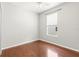 Bright bedroom features a ceiling fan, window, and wood-look flooring at 1611 Cresson Ridge Ln, Brandon, FL 33510