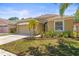 Charming single-story home features a well-manicured lawn, lovely landscaping, and an attached two-car garage at 1611 Cresson Ridge Ln, Brandon, FL 33510