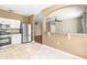 Modern kitchen features stainless steel appliances, white cabinetry, and an open breakfast bar at 1611 Cresson Ridge Ln, Brandon, FL 33510