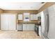 This kitchen offers tile floors, white cabinets, stainless steel appliances, and good natural light at 1611 Cresson Ridge Ln, Brandon, FL 33510