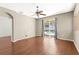 Living area has a sliding glass door leading to the pool area and a ceiling fan at 1611 Cresson Ridge Ln, Brandon, FL 33510