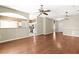Bright living space features wood floors, neutral paint, and an open layout to kitchen and dining area at 1611 Cresson Ridge Ln, Brandon, FL 33510