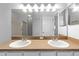 This bathroom has a double sink, large mirror, and lots of light at 1611 Cresson Ridge Ln, Brandon, FL 33510