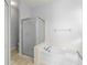 Bright main bathroom featuring a shower, a bathtub, and neutral paint at 1611 Cresson Ridge Ln, Brandon, FL 33510