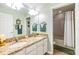 Bathroom featuring double sinks with granite countertops, a shower, and a bathtub at 19312 Sunset Bay Dr, Land O Lakes, FL 34638