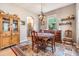 Cozy dining room with traditional furniture, unique light fixture, and decorative accents at 19312 Sunset Bay Dr, Land O Lakes, FL 34638