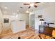 Hallway featuring hardwood flooring with multiple entry points and natural light at 19312 Sunset Bay Dr, Land O Lakes, FL 34638