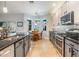 Modern kitchen featuring stainless steel appliances, tile backsplash, sleek countertops, and convenient breakfast nook with large windows at 19312 Sunset Bay Dr, Land O Lakes, FL 34638