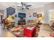 Comfortable living room offers ample seating, a ceiling fan, and access to other living areas at 19312 Sunset Bay Dr, Land O Lakes, FL 34638