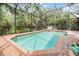 Screened-in pool boasts brick patio and provides a private backyard oasis for relaxation at 19312 Sunset Bay Dr, Land O Lakes, FL 34638