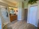 Bathroom featuring a glass enclosed shower, closet, and large vanity with a mirror at 2041 Gold Dust Ct, Trinity, FL 34655