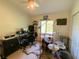 Bedroom with desk, instruments, fan, and window providing natural light at 2041 Gold Dust Ct, Trinity, FL 34655