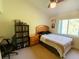 Bedroom with desk, fan, and bed next to a window providing natural light at 2041 Gold Dust Ct, Trinity, FL 34655