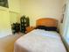 Bedroom with desk, fan, and bed next to a window providing natural light at 2041 Gold Dust Ct, Trinity, FL 34655