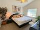 Comfortable bedroom with fan, side table, and window providing natural light, creating a serene space at 2041 Gold Dust Ct, Trinity, FL 34655